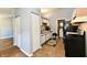 Functional kitchen featuring white cabinets, essential appliances, and easy access to the laundry area at 1472 Maria Ave, Franklin, IN 46131