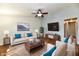 Bright living room with stylish furniture, hardwood floors, and a large TV at 1472 Maria Ave, Franklin, IN 46131