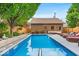 Backyard pool area with brick pool house, lounge seating, landscaping, and privacy fence at 1510 Central Ave, Indianapolis, IN 46202