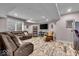 Finished basement with a cozy seating area, entertainment center, and stylish flooring at 1510 Central Ave, Indianapolis, IN 46202
