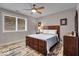 Cozy bedroom with modern furniture, natural light, and ceiling fan at 1510 Central Ave, Indianapolis, IN 46202