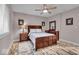 Serene bedroom with wood-look flooring, and natural light with modern decor at 1510 Central Ave, Indianapolis, IN 46202