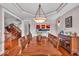 Formal dining room with wood floors, decorative lighting, and a buffet against the wall for serving and entertaining guests at 1510 Central Ave, Indianapolis, IN 46202