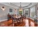 Spacious dining room with hardwood floors, large windows, and elegant lighting at 1510 Central Ave, Indianapolis, IN 46202