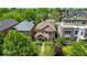 Well-maintained exterior view showing a charming home with manicured landscaping and mature shade trees in a desirable area at 1510 Central Ave, Indianapolis, IN 46202
