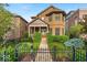 Charming brick home with manicured lawn and black fence in a desirable neighborhood at 1510 Central Ave, Indianapolis, IN 46202
