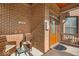 Inviting front porch with brick wall, seating area, and a warm welcome at 1510 Central Ave, Indianapolis, IN 46202