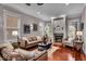 Inviting living room with a fireplace, hardwood floors, and comfortable leather seating at 1510 Central Ave, Indianapolis, IN 46202