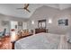Large main bedroom with ceiling fan, hardwood floors, sitting area, and large windows for plenty of natural light at 1510 Central Ave, Indianapolis, IN 46202