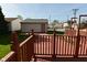 Backyard features a deck and access to the detached garage, surrounded by a well-kept lawn at 1615 N E St, Elwood, IN 46036