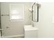 Bathroom sink with a modern faucet and a large mirror, illuminated by a light fixture above at 1615 N E St, Elwood, IN 46036