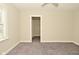 Bedroom features carpeting and a window; an entrance to a closet is also visible at 1615 N E St, Elwood, IN 46036