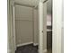 A closet with shelving and rod space is adjacent to the bathroom at 1615 N E St, Elwood, IN 46036