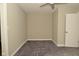 Neutral bedroom features soft carpeting and a ceiling fan at 1615 N E St, Elwood, IN 46036