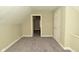 Bedroom featuring neutral walls and carpet, textured ceiling, and a single door to the side at 1615 N E St, Elwood, IN 46036