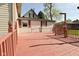 Expansive wooden deck, ideal for outdoor entertaining and relaxation, with stylish railing at 1615 N E St, Elwood, IN 46036
