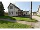 Charming two-story home with well-maintained lawn, inviting porch, and a detached garage; quintessential curb appeal at 1615 N E St, Elwood, IN 46036