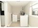 Bright laundry room featuring washer, dryer, and a window for natural light at 1615 N E St, Elwood, IN 46036
