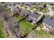 Aerial view of a well-maintained backyard with a patio, hot tub, and fire pit area at 16726 Blackbird Ct, Noblesville, IN 46060