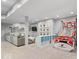 Finished basement featuring a cozy seating area, television, and a fun basketball game setup at 16726 Blackbird Ct, Noblesville, IN 46060