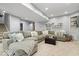 Finished basement with a large sectional couch and entertainment area, ideal for relaxation and gatherings at 16726 Blackbird Ct, Noblesville, IN 46060