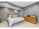 Finished basement bedroom with neutral colors, comfortable bedding, and wood cabinet at 16726 Blackbird Ct, Noblesville, IN 46060