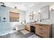 Elegant bathroom features a modern tub, double vanity, and walk-in shower at 16726 Blackbird Ct, Noblesville, IN 46060