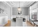 Formal dining room with white chairs, crown molding, and elegant chandelier at 16726 Blackbird Ct, Noblesville, IN 46060