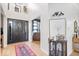 Welcoming foyer with high ceilings and modern decor, enhanced by a stylish rug and ample lighting at 16726 Blackbird Ct, Noblesville, IN 46060