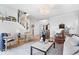 Inviting living area with stylish furniture, contemporary decor, and an open staircase at 16726 Blackbird Ct, Noblesville, IN 46060