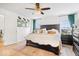 Comfortable main bedroom with a wooden bed, decorative pillows, and two windows allowing natural light at 16726 Blackbird Ct, Noblesville, IN 46060