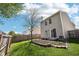 This home has a yard with green grass, garden area and a wood fence that surrounds the property at 16780 Lowell Dr, Noblesville, IN 46060