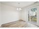 Cozy dining area with stylish lighting and sliding glass doors at 16780 Lowell Dr, Noblesville, IN 46060