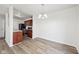 Open dining area with sleek flooring, seamless kitchen access and abundant light at 16780 Lowell Dr, Noblesville, IN 46060