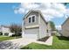 Attractive two-story home with a cozy feel, featuring an attached garage and green lawn at 16780 Lowell Dr, Noblesville, IN 46060
