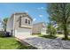 Inviting home with a convenient driveway and charming exterior details at 16780 Lowell Dr, Noblesville, IN 46060