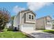 Lovely two-story home featuring an attached garage and well-manicured front yard at 16780 Lowell Dr, Noblesville, IN 46060