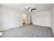 Bedroom with carpet, ceiling fan, ensuite bathroom, and natural light at 16780 Lowell Dr, Noblesville, IN 46060