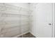 Pantry with multiple white wire shelves and a white door at 16780 Lowell Dr, Noblesville, IN 46060