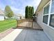Back deck overlooking the green lawn of this bright house with mature landscaping at 16869 Cimarron Pass, Noblesville, IN 46060