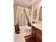 Cozy bathroom with warm color palette and a shower-tub combination at 16869 Cimarron Pass, Noblesville, IN 46060
