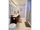 Well-lit bathroom featuring a double sink vanity, neutral flooring, and a walk-in shower at 16869 Cimarron Pass, Noblesville, IN 46060