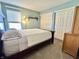 Comfortable bedroom featuring hardwood floors, natural light, and double closets at 16869 Cimarron Pass, Noblesville, IN 46060