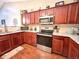 Well-equipped kitchen with stainless steel appliances, granite countertops, and ample cabinet space for storage at 16869 Cimarron Pass, Noblesville, IN 46060