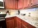 Close up view of a kitchen counter, with cabinets and granite counters at 16869 Cimarron Pass, Noblesville, IN 46060