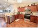 Well-equipped kitchen with stainless steel appliances, granite countertops, and ample cabinet space at 16869 Cimarron Pass, Noblesville, IN 46060