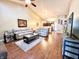 Spacious open floor plan with a view of the kitchen, wood flooring, and comfortable seating at 16869 Cimarron Pass, Noblesville, IN 46060