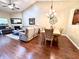 Spacious living and dining area with hardwood floors, a vaulted ceiling, and comfortable furniture at 16869 Cimarron Pass, Noblesville, IN 46060