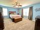 Inviting primary bedroom with natural light, ceiling fan, and neutral carpeting at 16869 Cimarron Pass, Noblesville, IN 46060