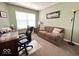 Cozy office space featuring natural light, a comfortable couch, and a functional desk setup at 16869 Cimarron Pass, Noblesville, IN 46060